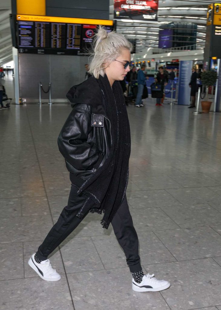 Cara Delevingne Arrives at Heathrow Airport in London 03/26/2017-4