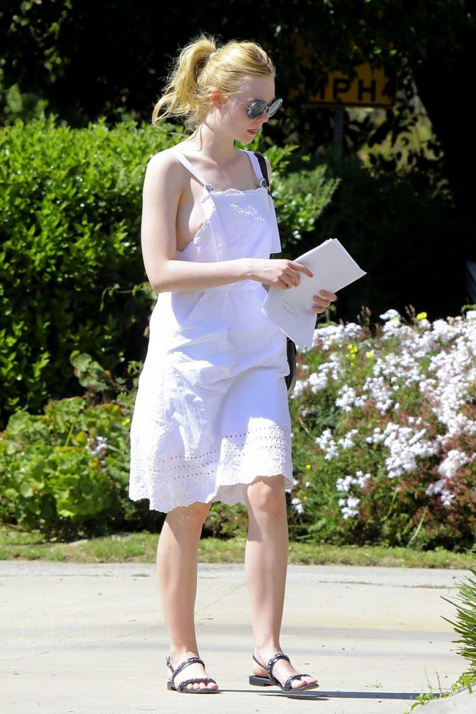 Elle Fanning Wears a Fitting White Sundress Out in LA 03/15/2017-2
