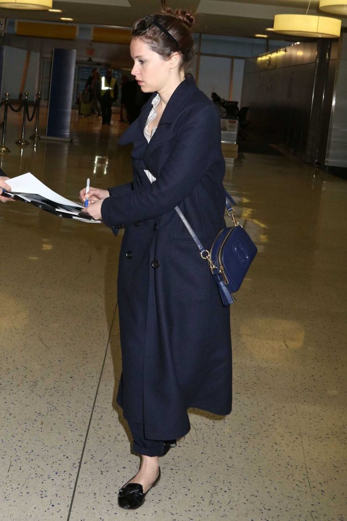 Felicity Jones Arrives at JFK Airport in New York 02/27/2017-5