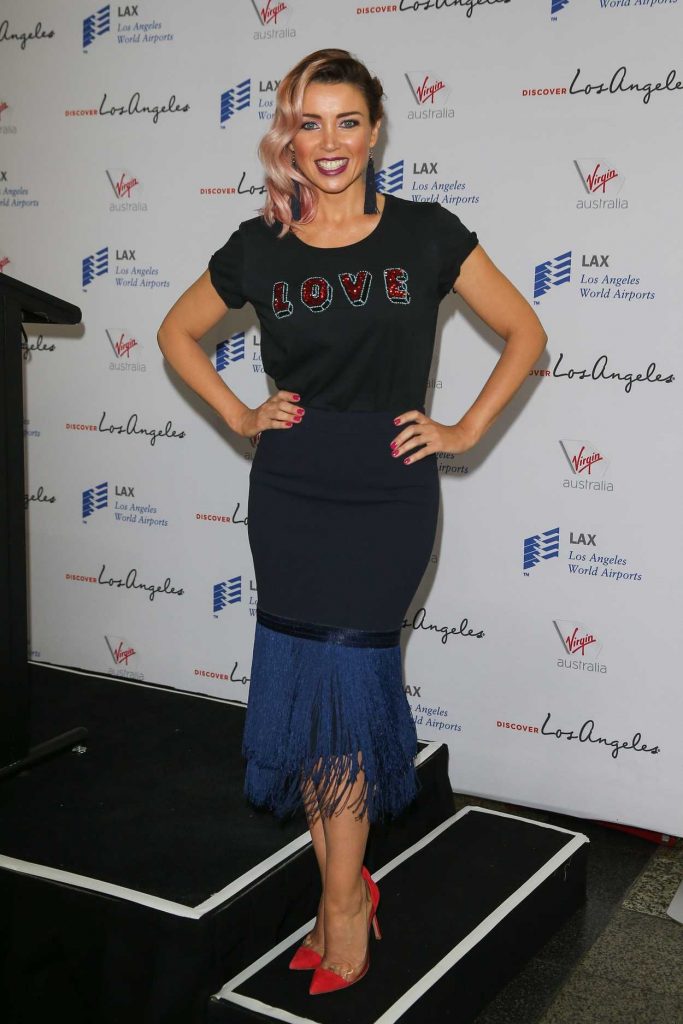 The 45-year-old Award-winning singer, actress, and reality TV star Dannii Minogue, who sang hit songs like "Love and Kisses" and "Jump to the Beat", attends a media call for Virgin Australia at Melbourne Airport.-4