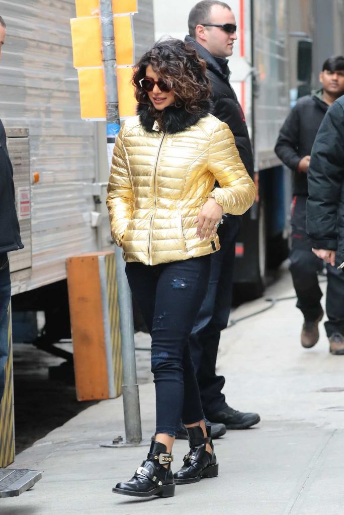 Priyanka Chopra Wears a Gold Puffy Coat with Dark Jeans on the Set of Quantico in NYC 02/04/2018-2