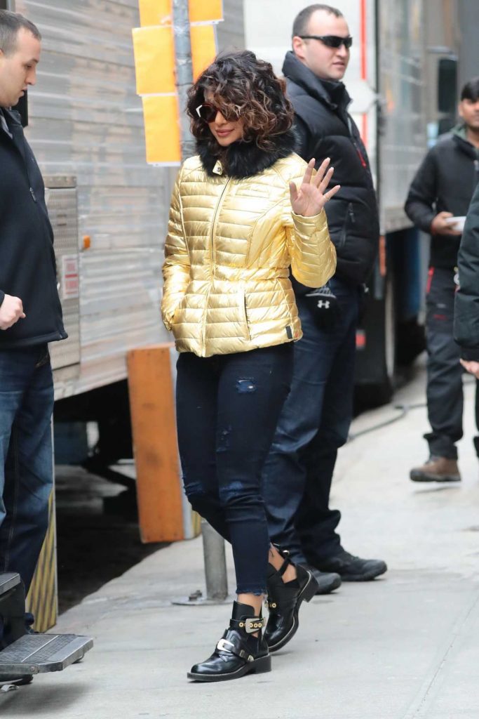 Priyanka Chopra Wears a Gold Puffy Coat with Dark Jeans on the Set of Quantico in NYC 02/04/2018-3