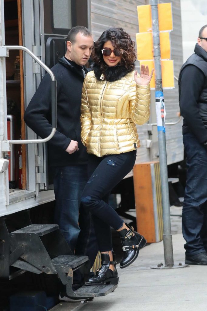 Priyanka Chopra Wears a Gold Puffy Coat with Dark Jeans on the Set of Quantico in NYC 02/04/2018-4