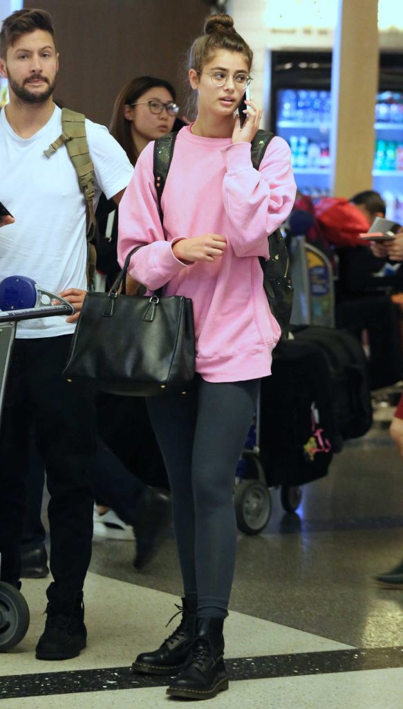 Taylor Hill Wears a Pink Long Sleeve Sweatshirt at LAX Airport in LA 05/17/2018-4
