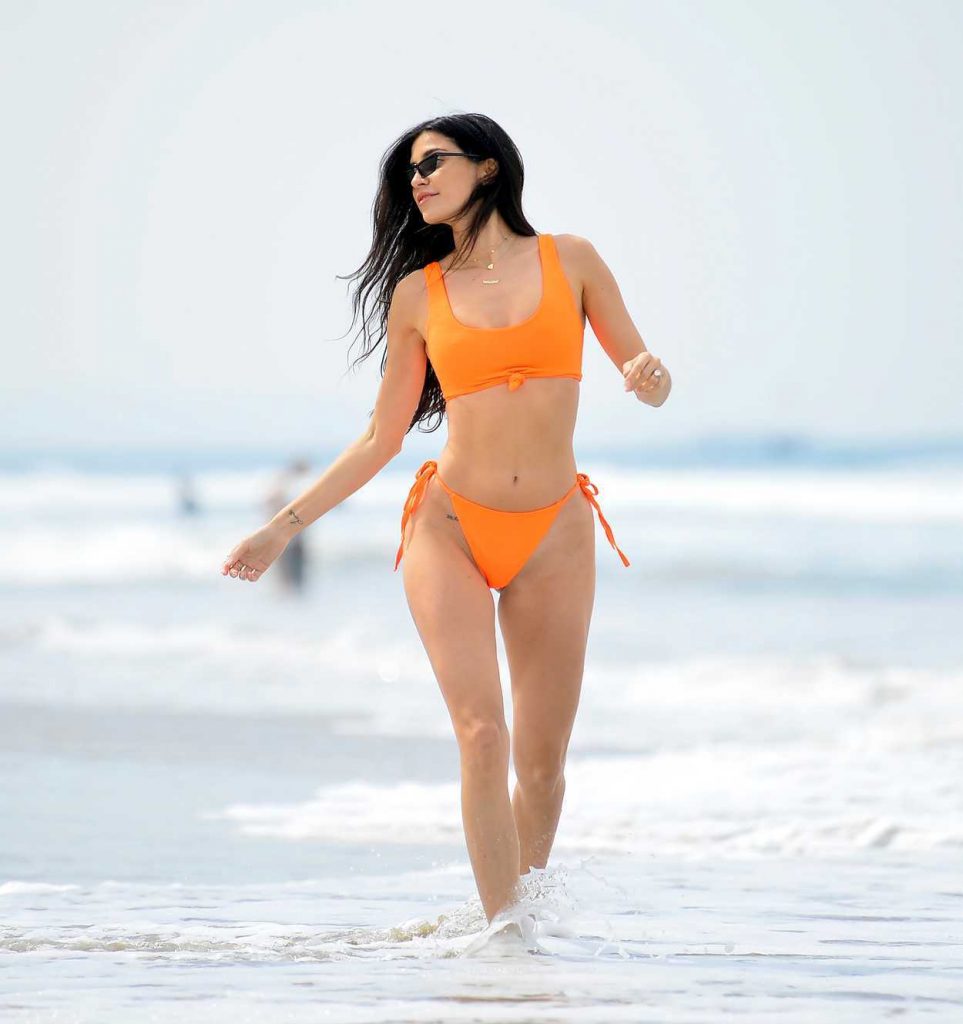Nicole Williams in an Orange Bikini
