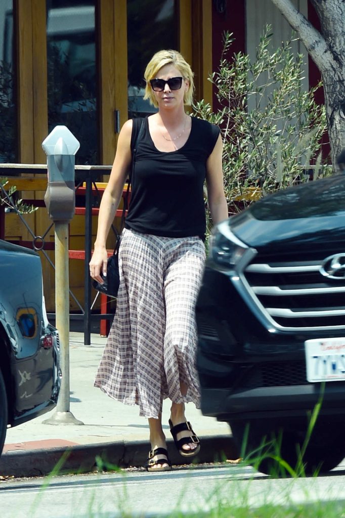 Charlize Theron in a Long Plaid Skirt