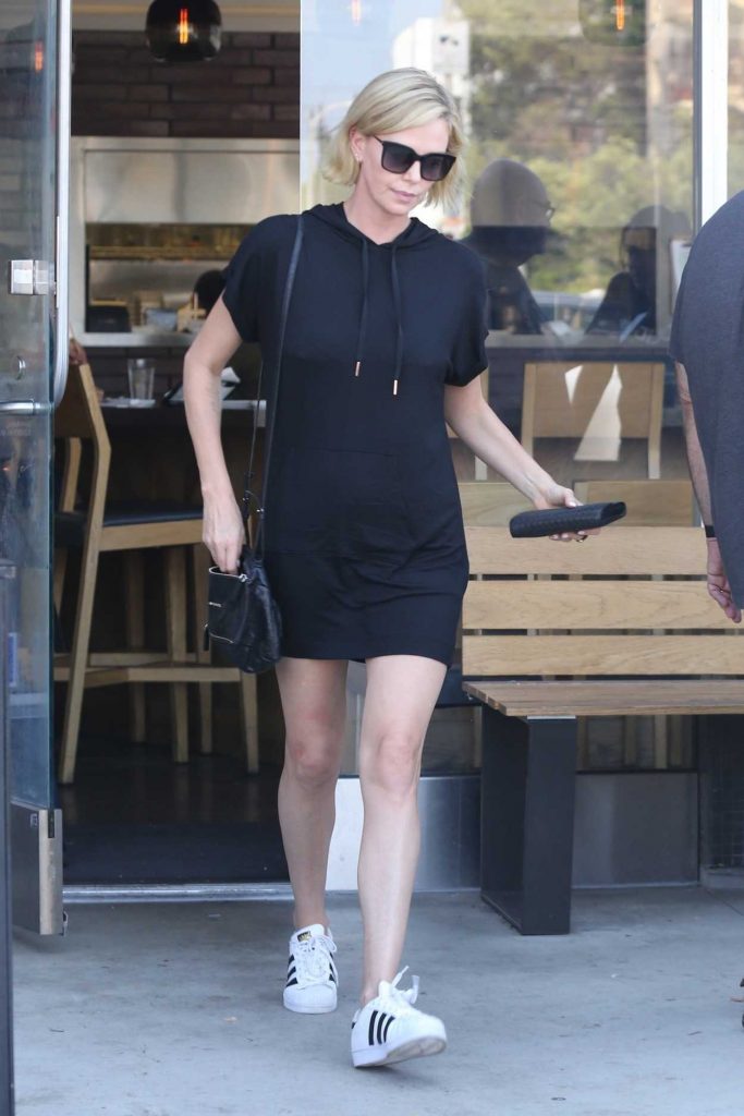 Charlize Theron in a White Adidas Superstar Sneakers