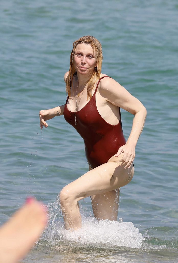 Courtney Love in a Burgundy Swimsuit