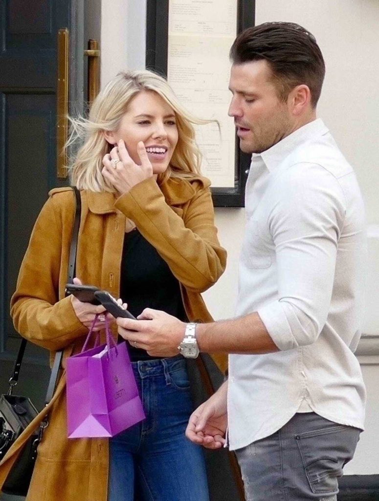 Mollie King in a Tan Trench Coat