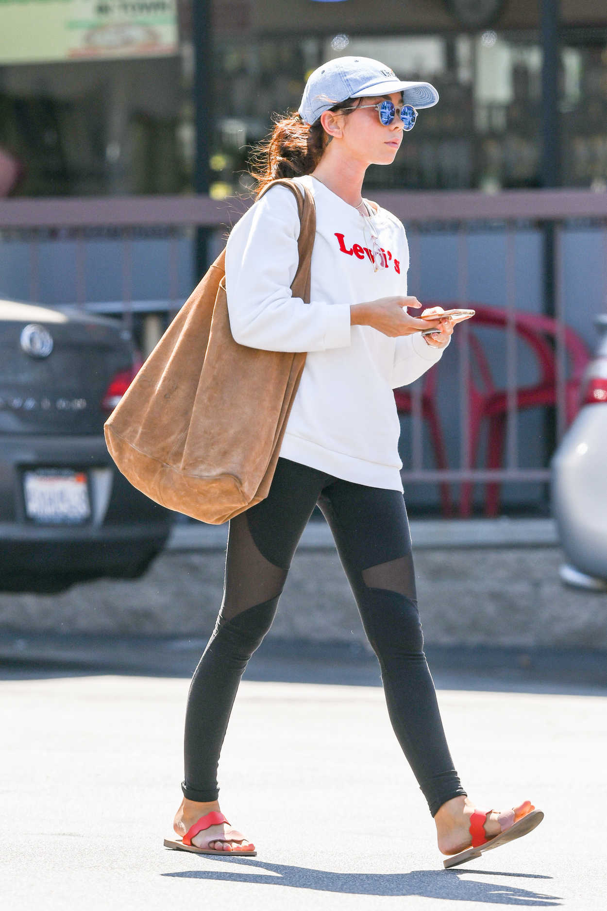 Sarah Hyland in a White Levis Sweatshirt Leaves a Cryotherapy Session ...