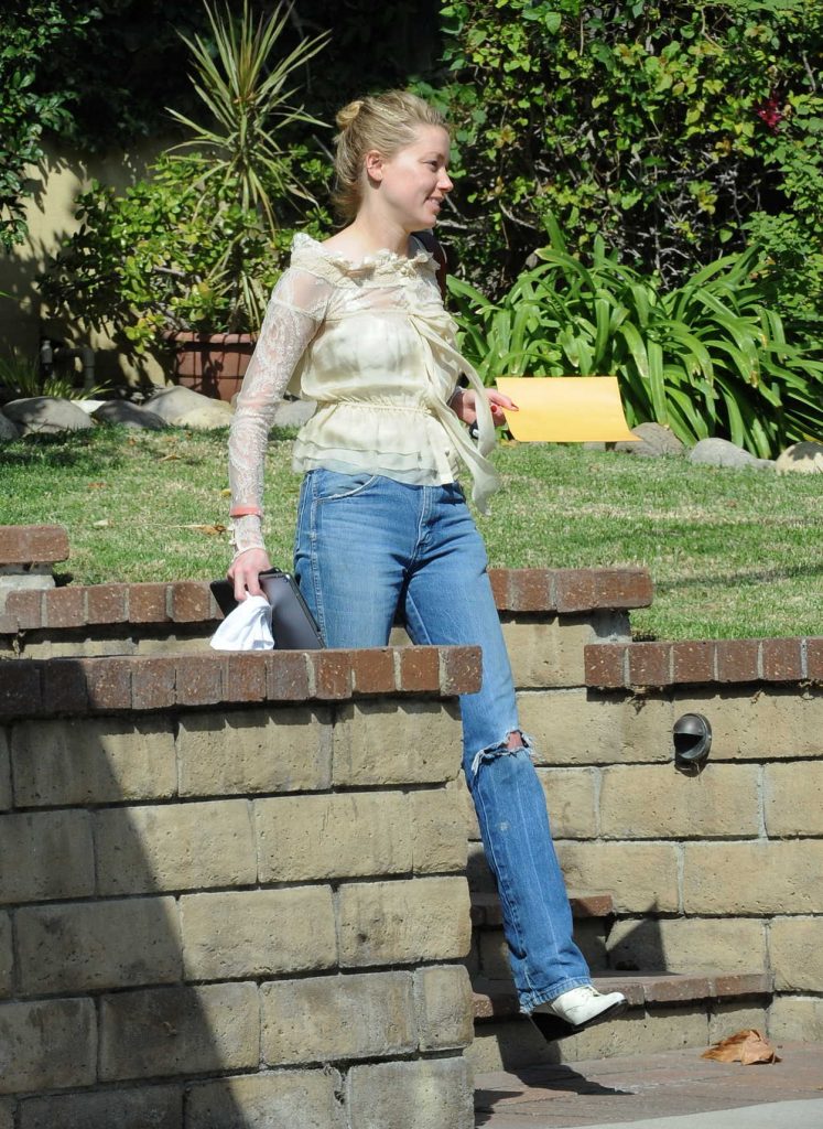 Amber Heard in a Blue Ripped Jeans