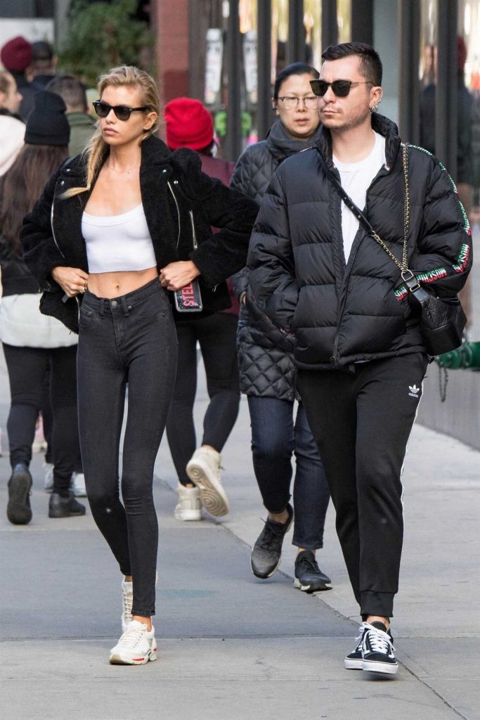 Stella Maxwell in a Short Black Synthetic Fur Jacket