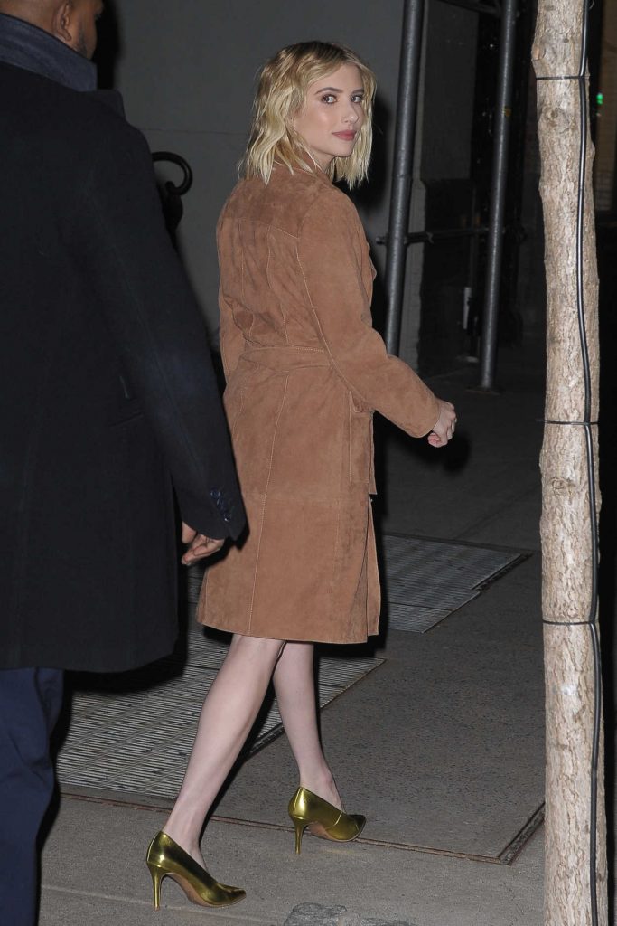 Emma Roberts in a Beige Trench Coat