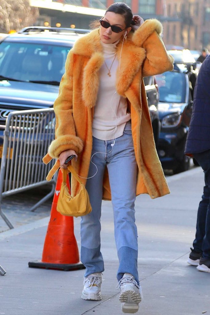 Bella Hadid in an Orange Fur Coat