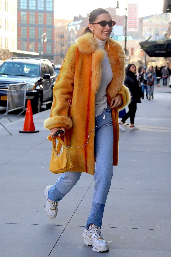 Bella Hadid in an Orange Fur Coat