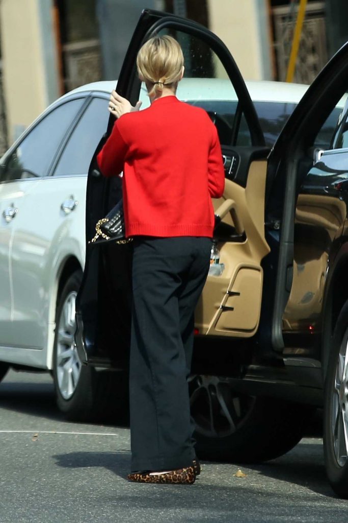 Emma Roberts in a Red Blazer