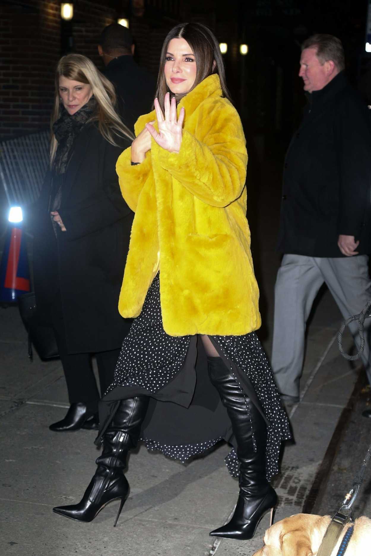 Sandra Bullock in a Short Yellow Fur Coat Arrives on The Late Show with