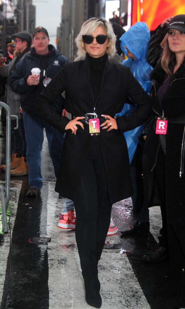 Bebe Rexha in a Black Coat