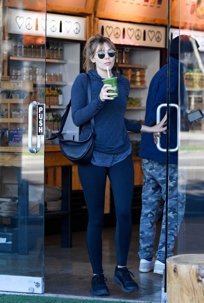 Elizabeth Olsen in a Blue Leggings