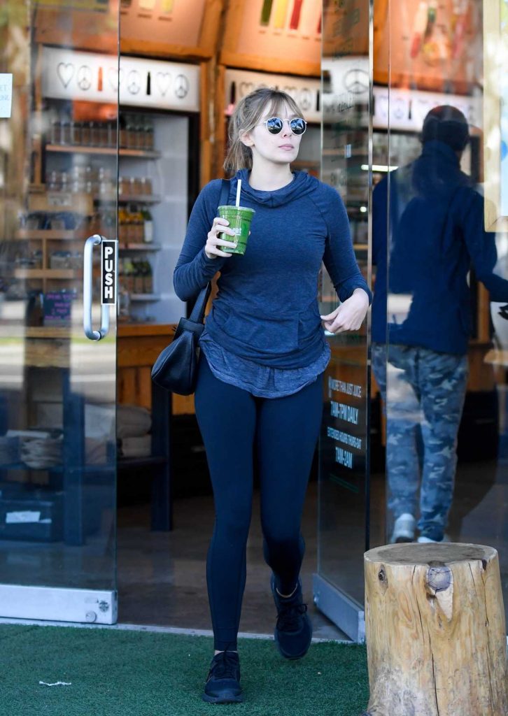 Elizabeth Olsen in a Blue Leggings