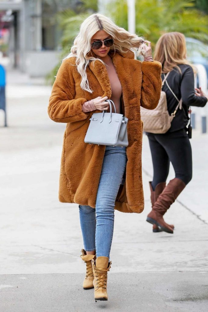 Khloe Kardashian in an Orange Fur Coat