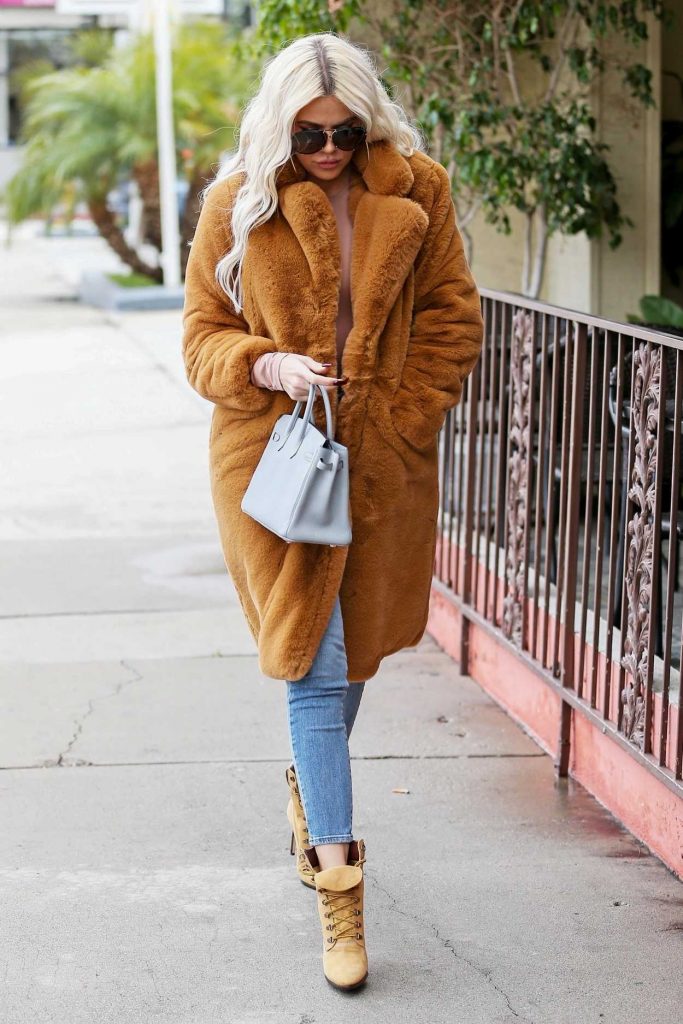 Khloe Kardashian in an Orange Fur Coat