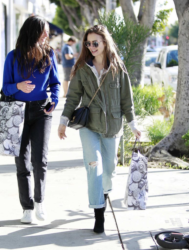 Lily Collins in a Blue Ripped Jeans