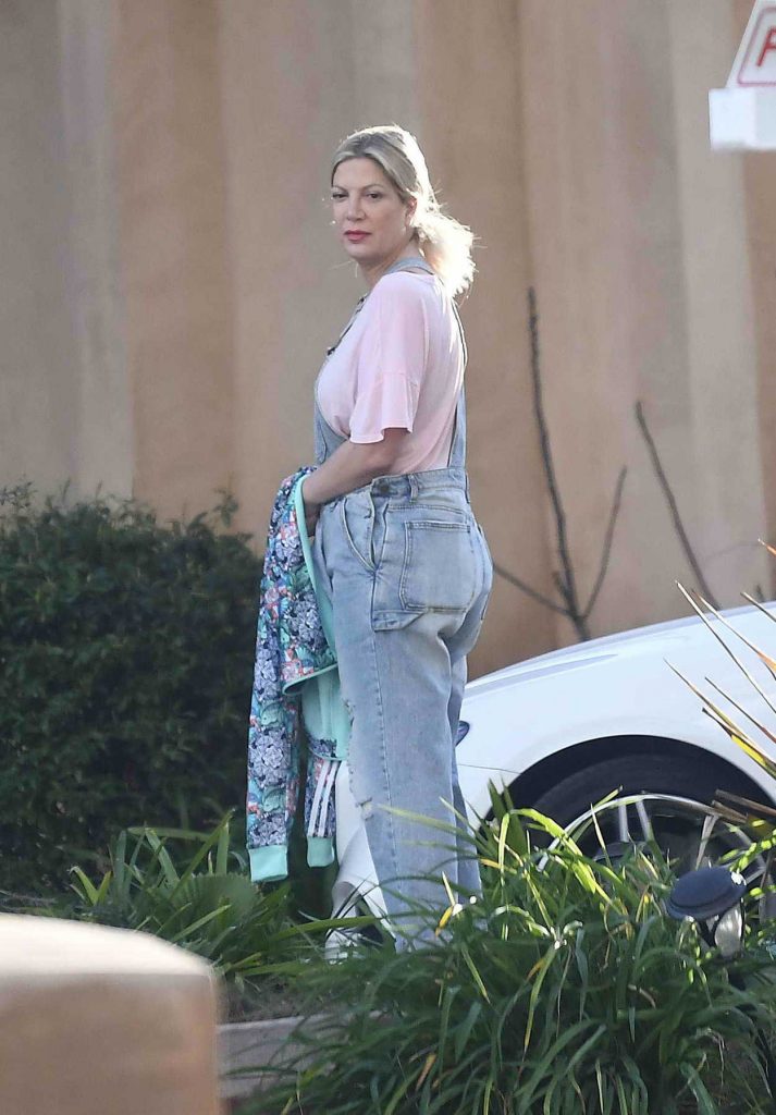 Tori Spelling in a Blue Ripped Overalls