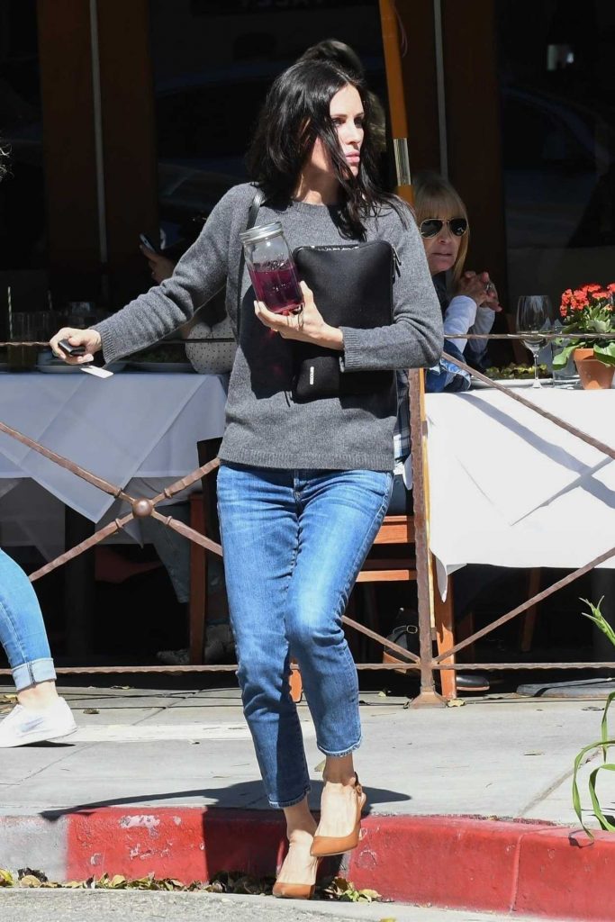 Courteney Cox in a Gray Sweater