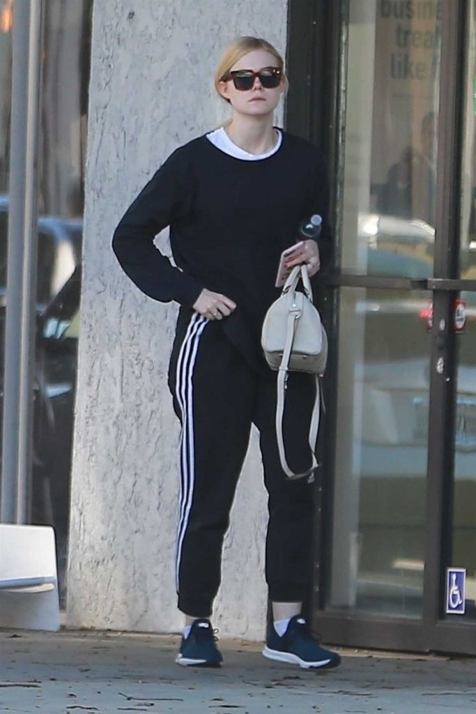 Elle Fanning in a Black Adidas Track Pants