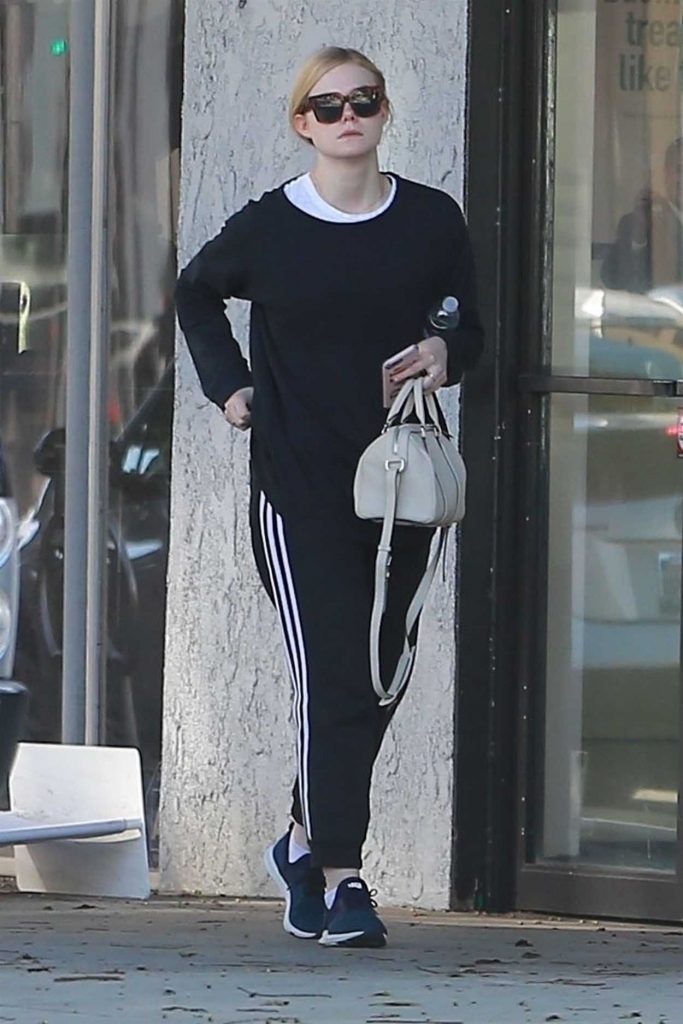 Elle Fanning in a Black Adidas Track Pants