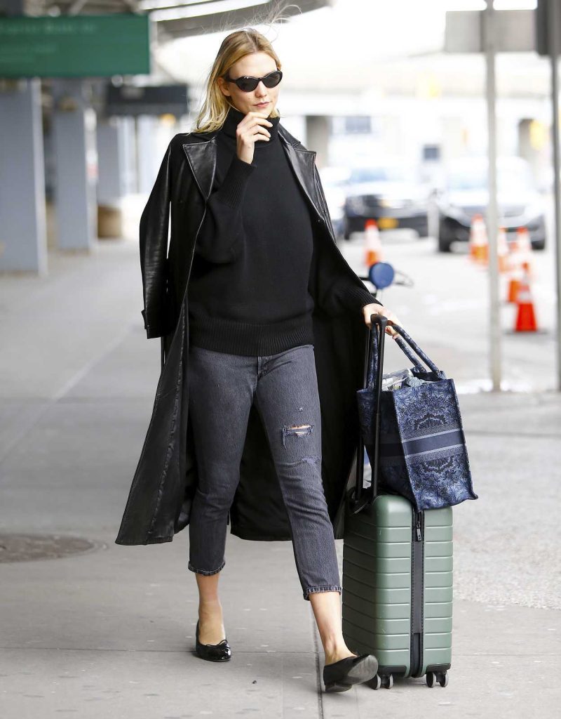 Karlie Kloss in a Black Leather Trench Coat