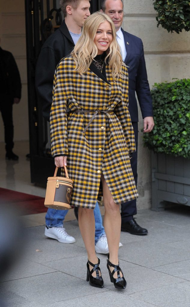 Sienna Miller Arrives at the Louis Vuitton Fashion Show During PFW in