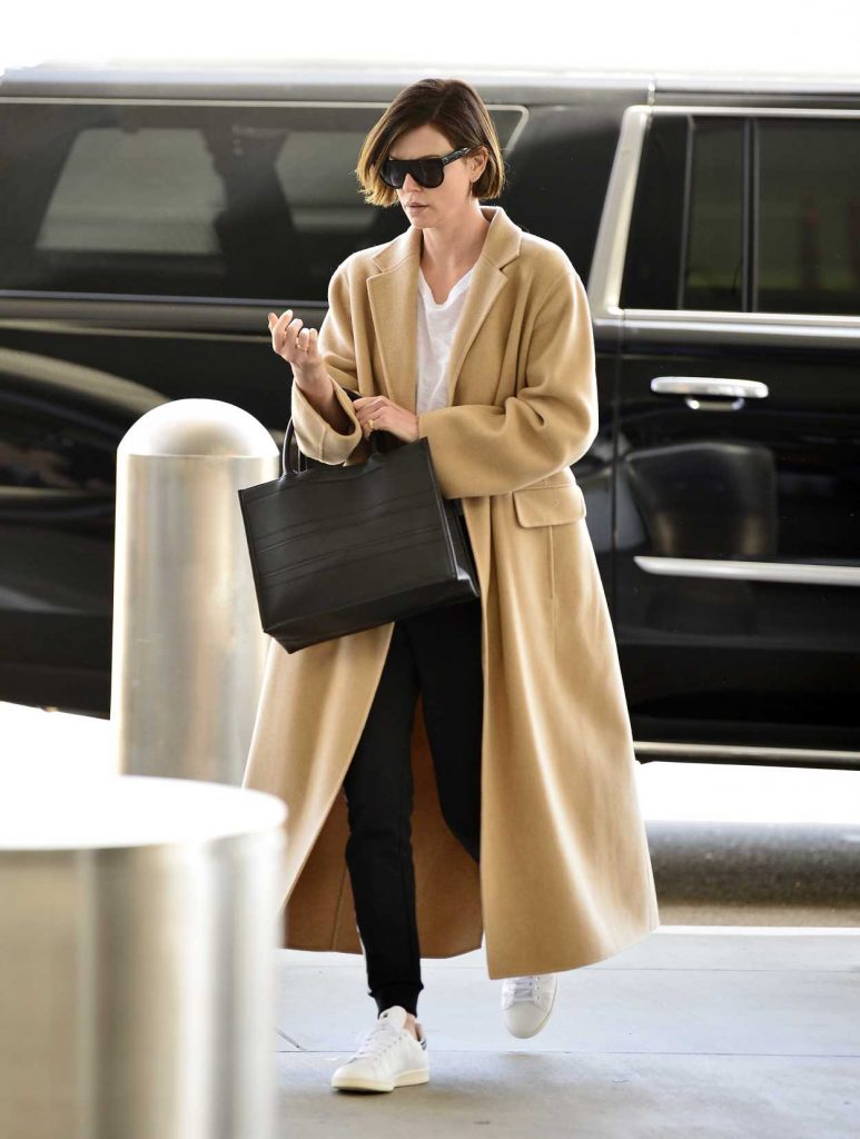 Charlize Theron in a Beige Coat