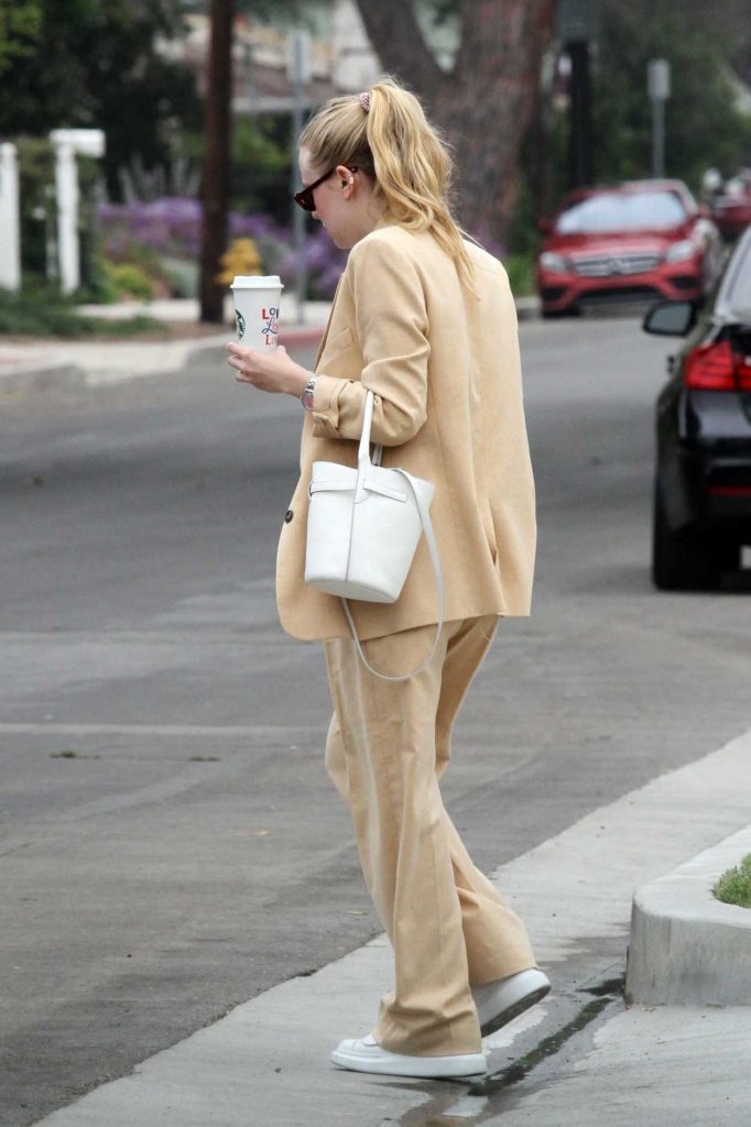 Dakota Fanning in a Beige Suit