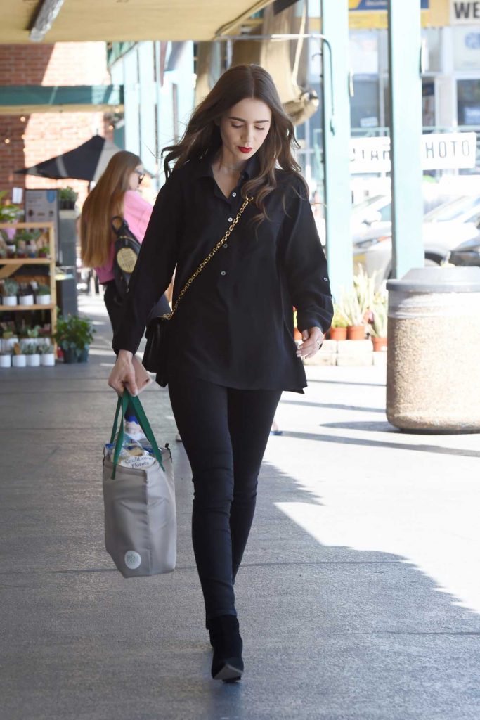 Lily Collins in a Black Shirt