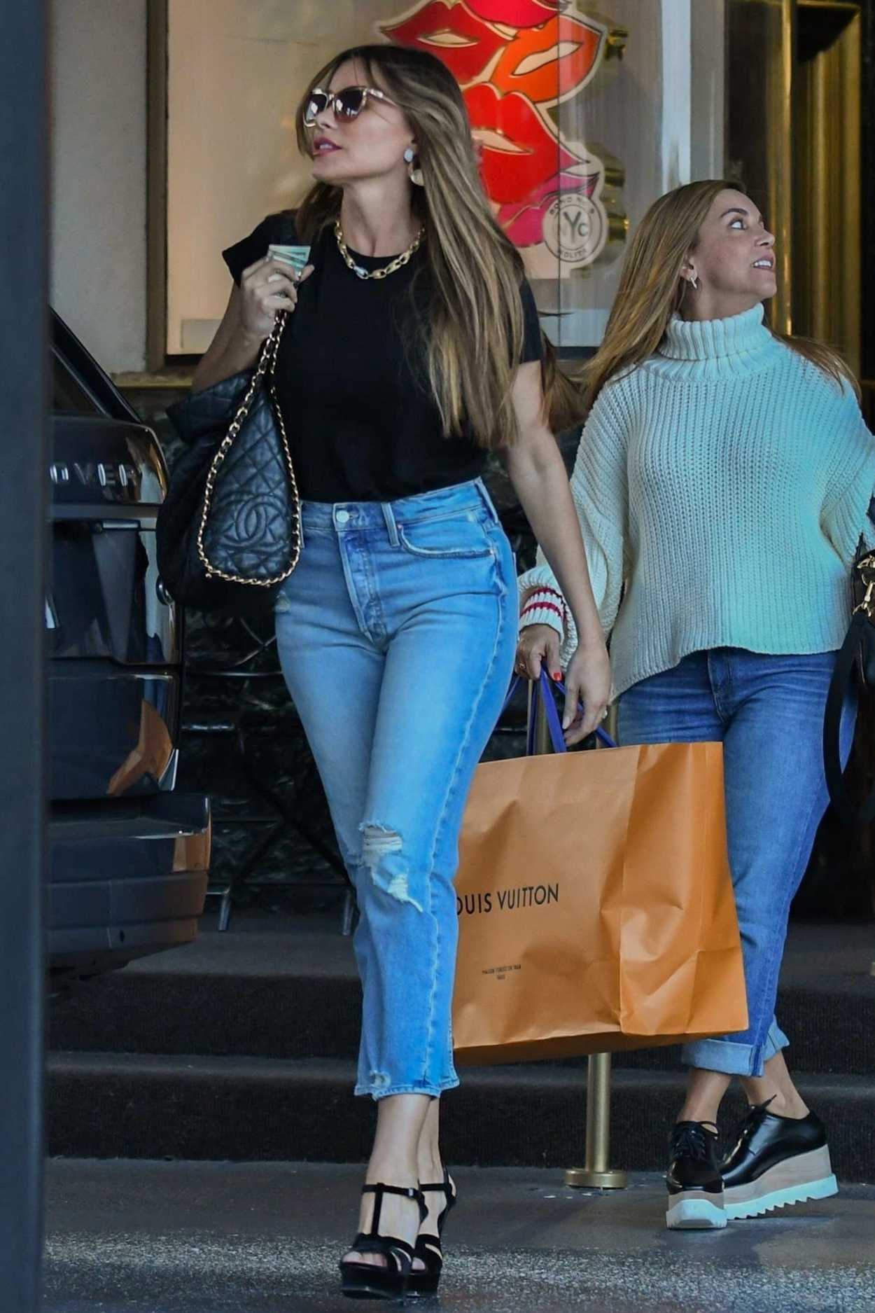 Sofia Vergara in a Blue Ripped Jeans Goes Shopping at Saks Fifth Avenue