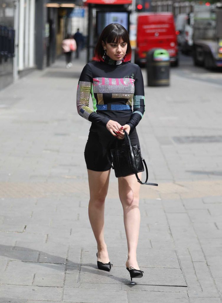 Charli XCX in a Black Skintight Playsuit