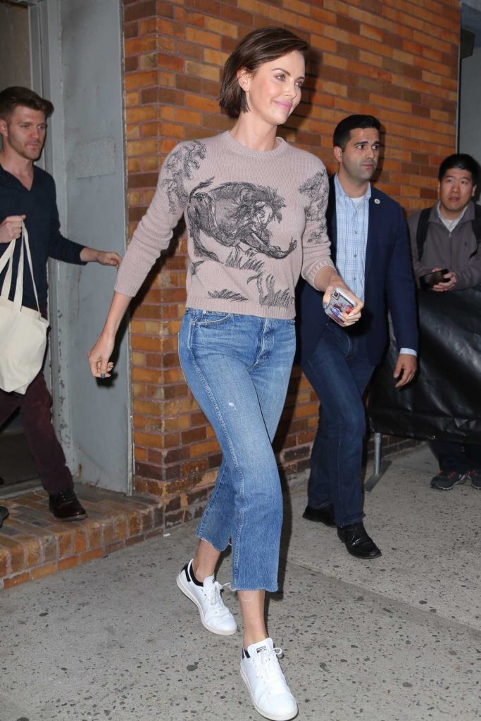 Charlize Theron in a White Adidas Sneakers