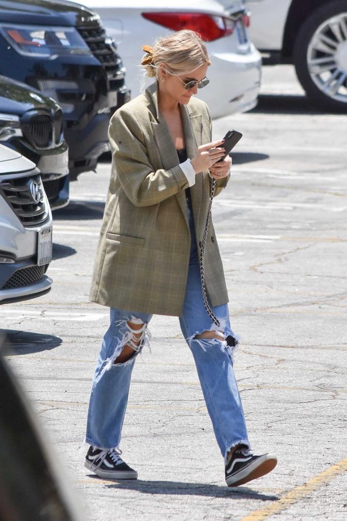 Ashlee Simpson in a Blue Ripped Jeans
