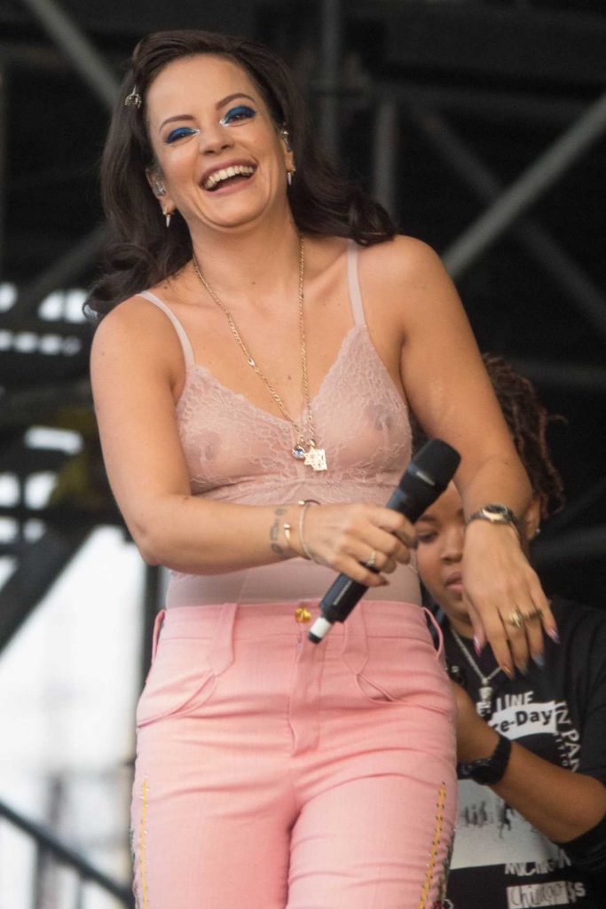 Lily Allen in a Pink Transparent Blouse