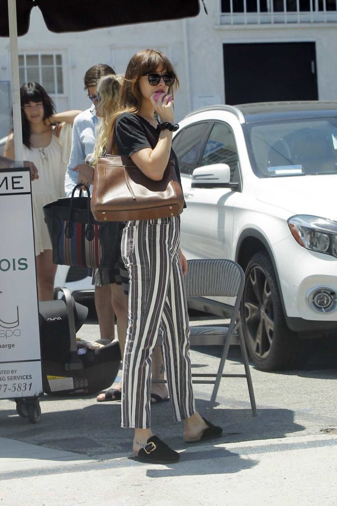Dakota Johnson in a Striped Jeans