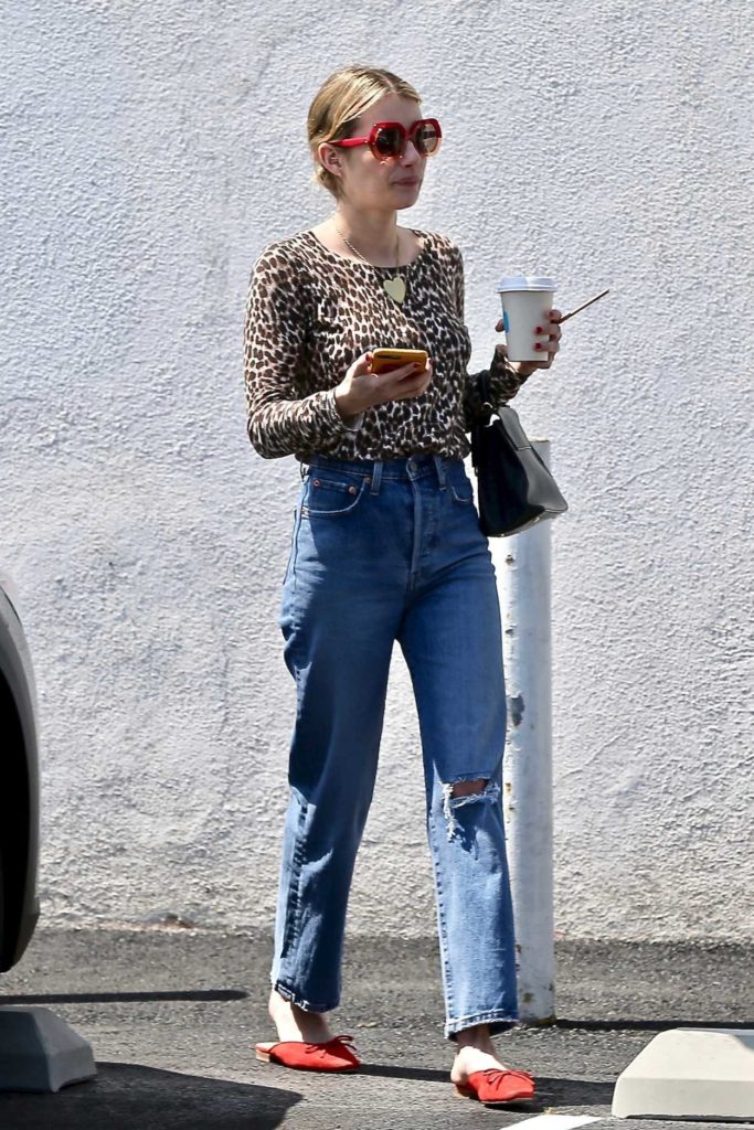 Emma Roberts in a Leopard Print Blouse
