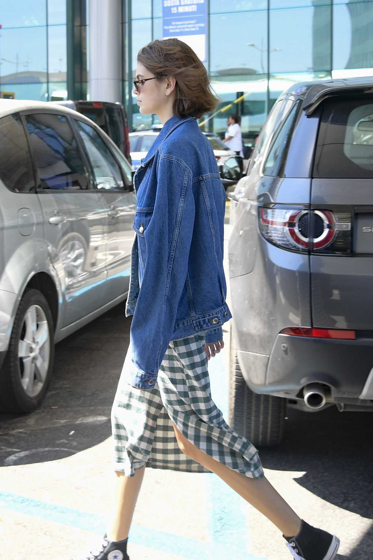 Kaia Gerber in a Blue Denim Jacket Arrives at Fiumicino Airport in Rome ...