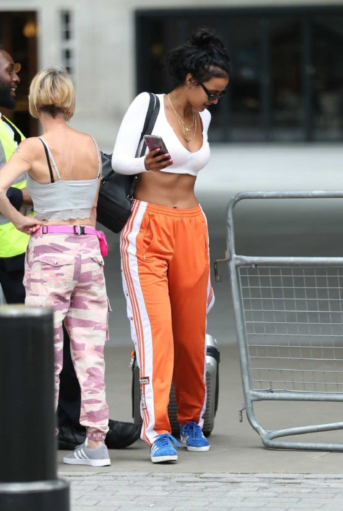 Maya Jama in an Orange Track Pants