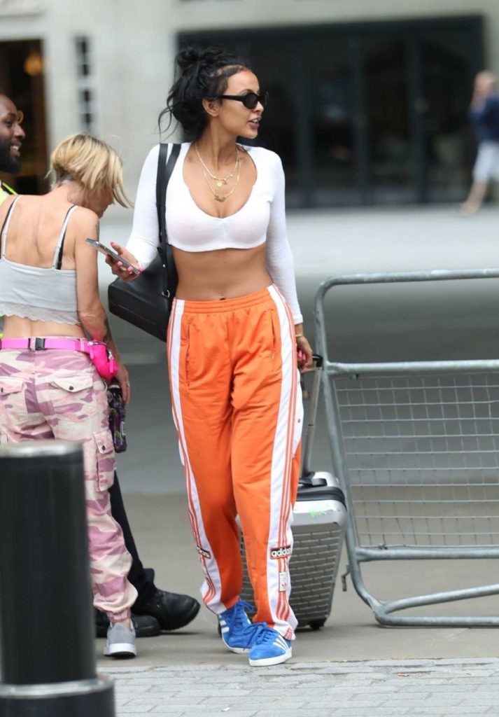 Maya Jama in an Orange Track Pants