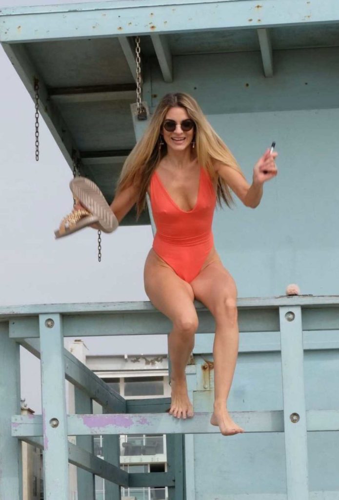 Rachel McCord in an Orange Swimsuit