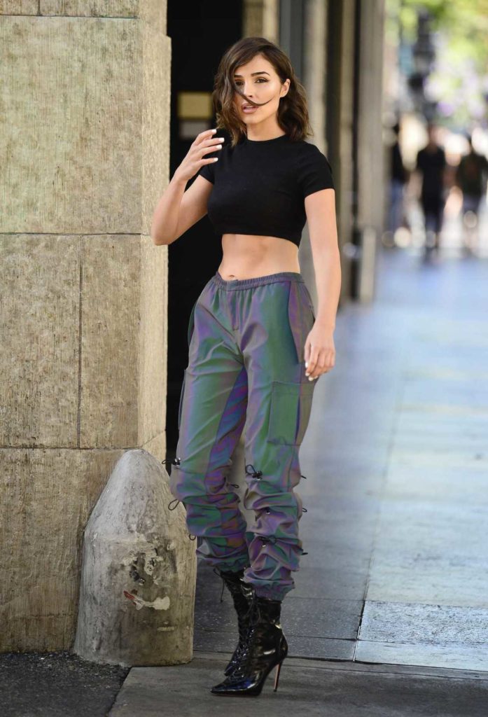 Olivia Culpo in a Two-Tone Reflective Pants