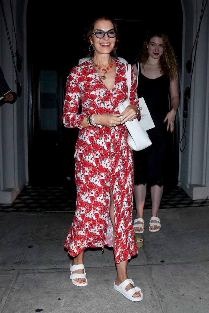 Sela Ward in a Red Floral Dress