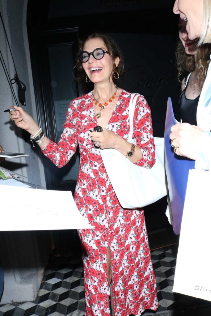 Sela Ward in a Red Floral Dress